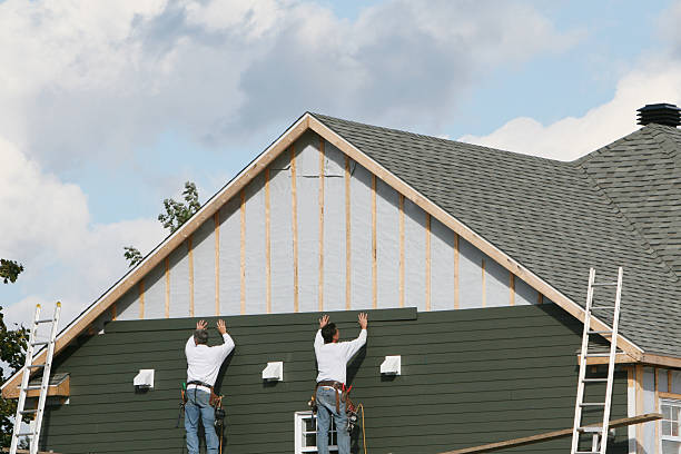 Professional Siding Installation technician working in Inwood, NY
